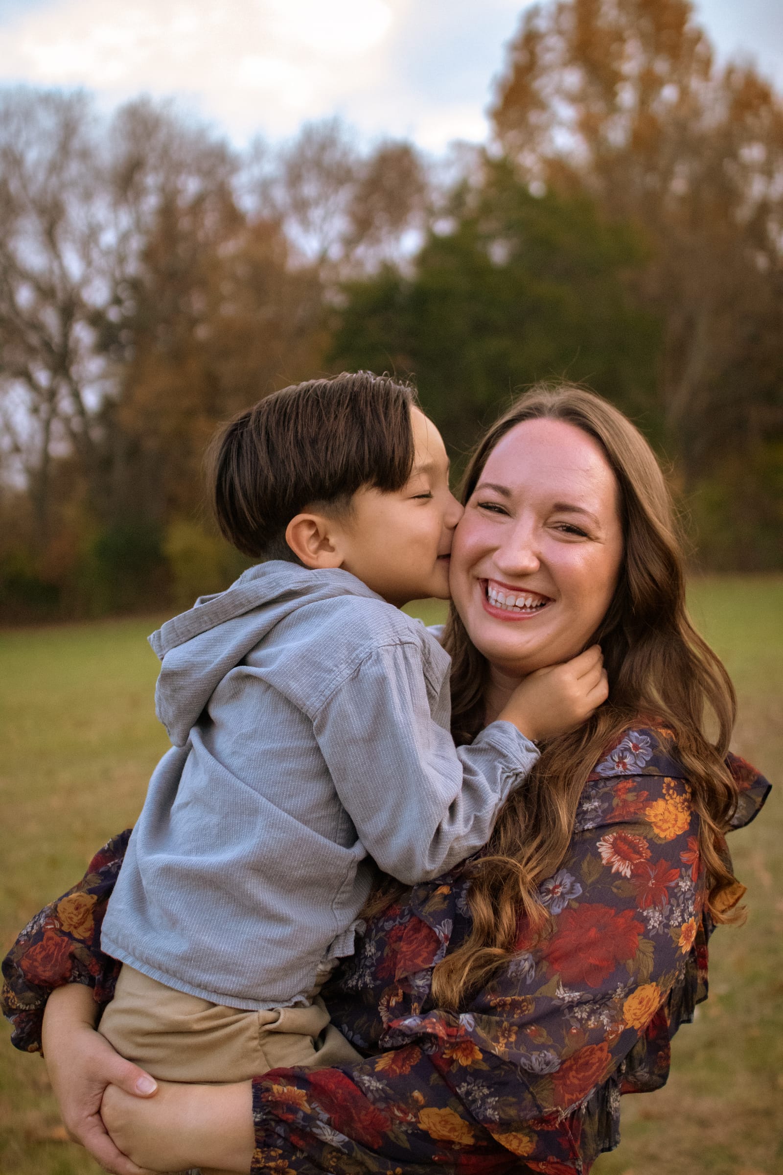 Son kissing mother on cheek