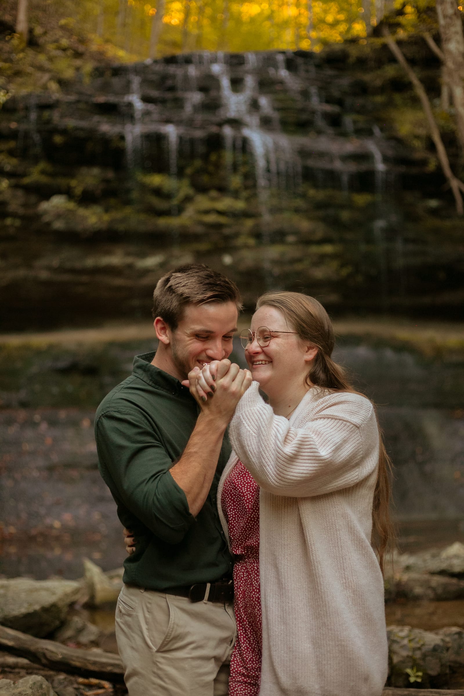 Couple laughing together during engagement session