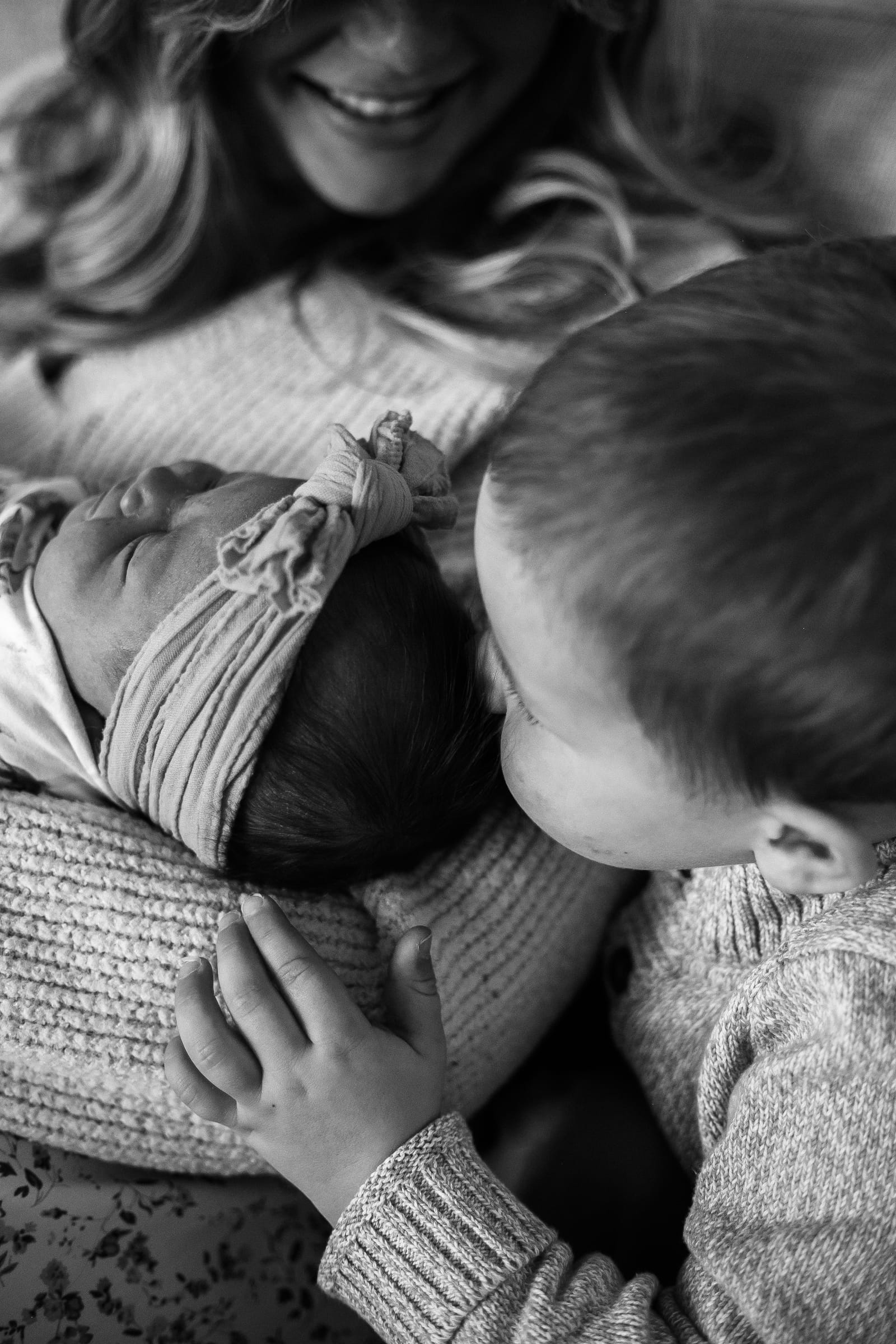 Sibling meeting newborn baby