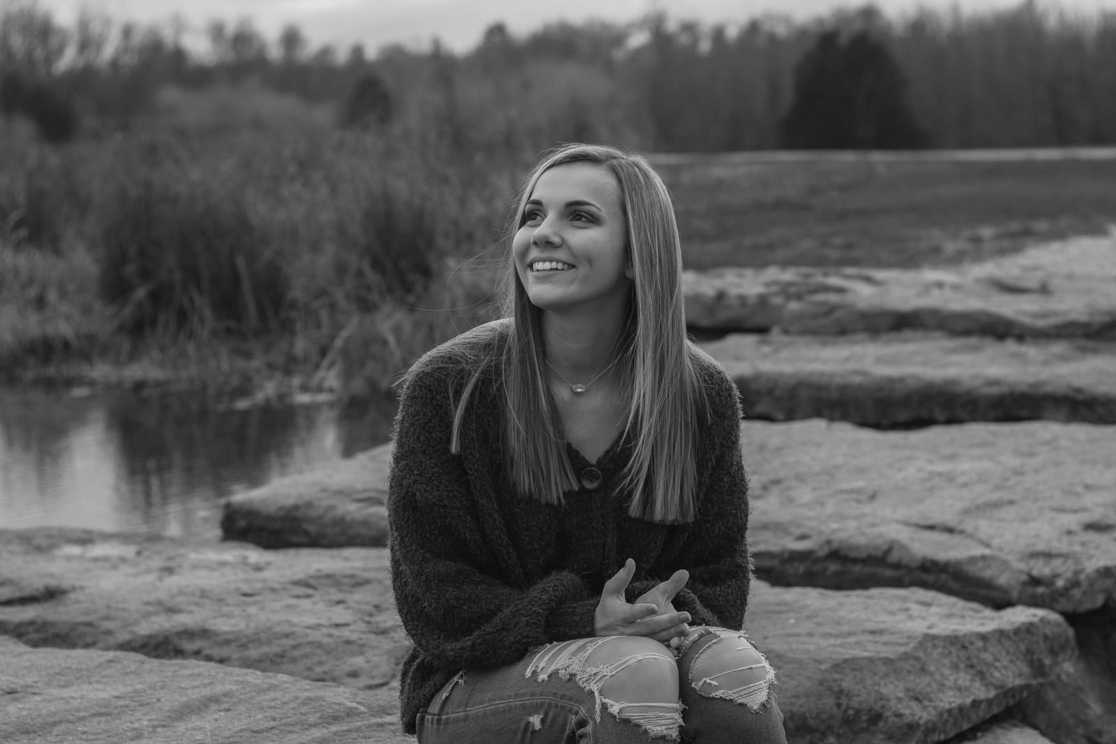 Black and white portrait by water