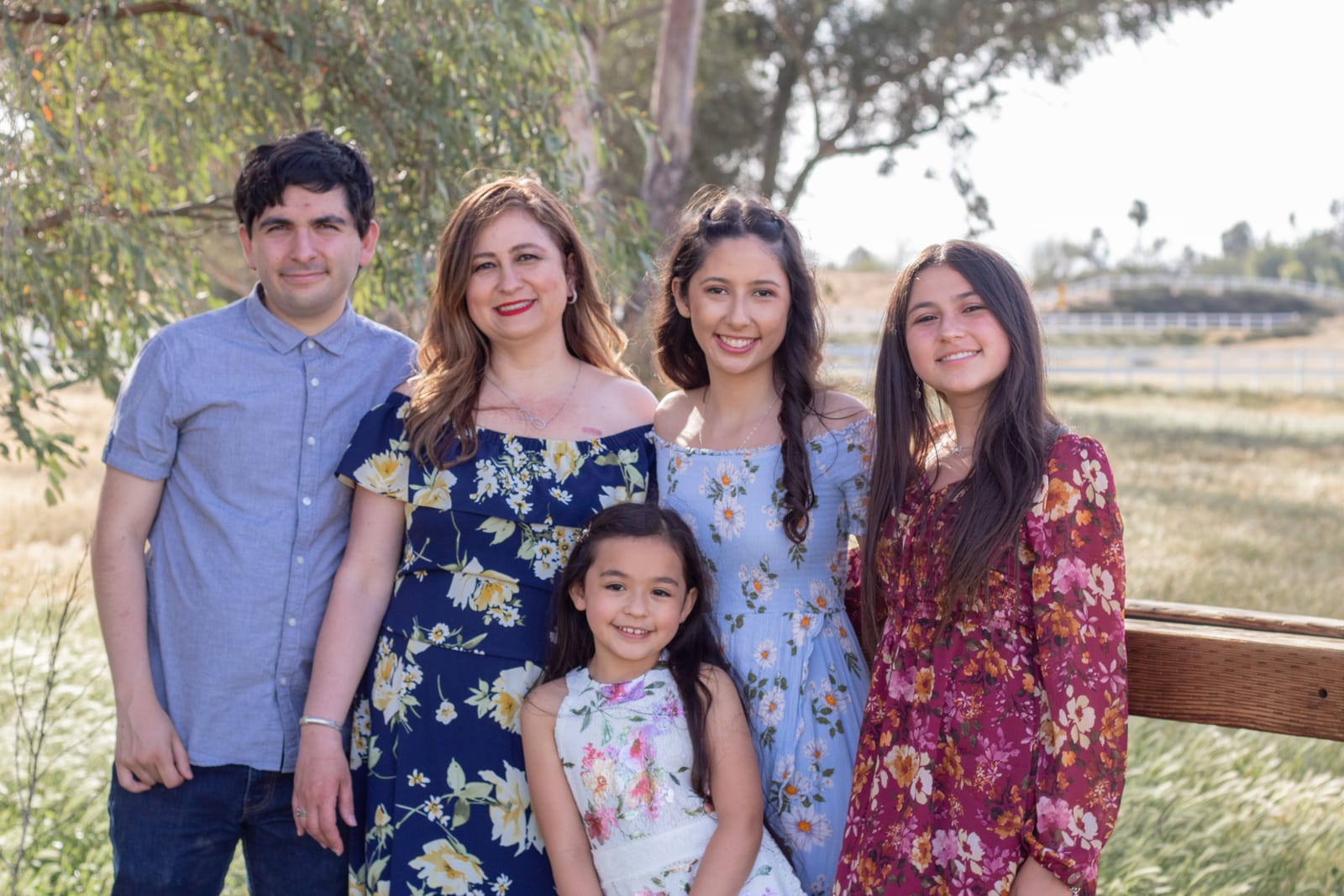 Family group portrait under a tree